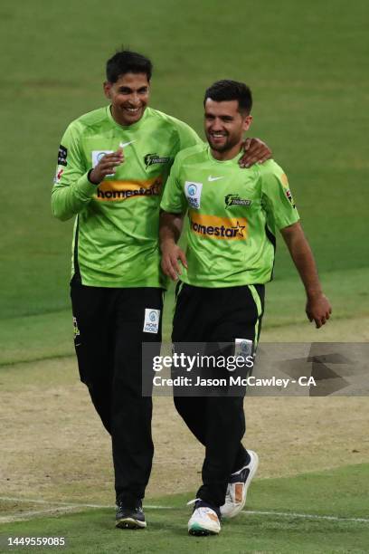 Fazalhaq Farooqi of the Thunder celebrates after taking the wicket of Wes Agar of the Strikers during the Men's Big Bash League match between the...