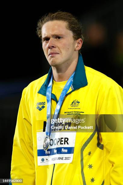 Silver medallist Isaac Cooper of Australia shows his emotion during the medal ceremony for the Men’s 50m Backstroke Final on day four of the 2022...