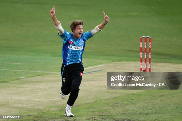 Henry Thornton of the Strikers celebrates after taking the wicket of Rilee Rossouw of the Thunder during the Men's Big Bash League match between the...