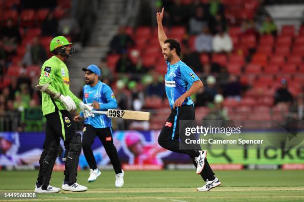 Wes Agar of the Strikers celebrates dismissing Gurinder Sandhu of the Thunder during the Men's Big Bash League match between the Sydney Thunder and...