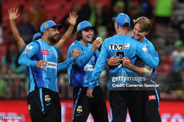 Henry Thornton of the Strikers celebrates with Matt Short of the Strikers after dismissing Brendan Doggett of the Thunder and winning the Men's Big...