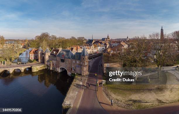 Water gate called Koppelpoort over the river Eem.