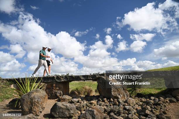 Dean Burmester of South Africa and Ockie Strydom of South Africa cross the bridge h13on Day Two of the AfrAsia Bank Mauritius Open at Mont Choisy Le...