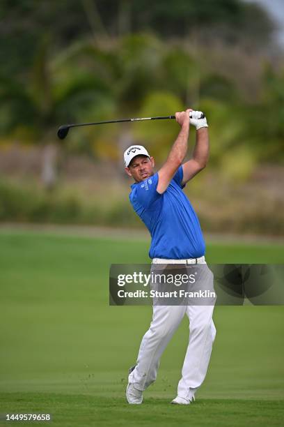 Jaco Van Zyl of South Africa plays his second shot on the 18th hole on Day One of the AfrAsia Bank Mauritius Open at Mont Choisy Le Golf on December...