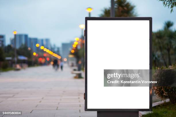 blank city format (lightposter, citylight) banner pylon on the public park mockup. evening illumination, street lighting - street light ストックフォトと画像