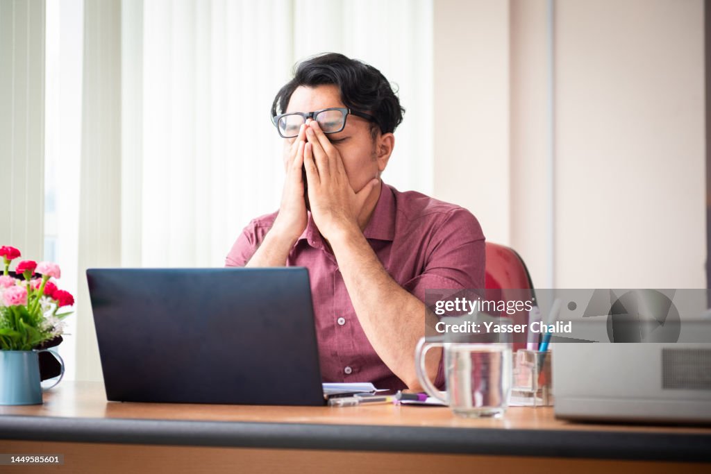 Office Worker Working Late and Looking Stress