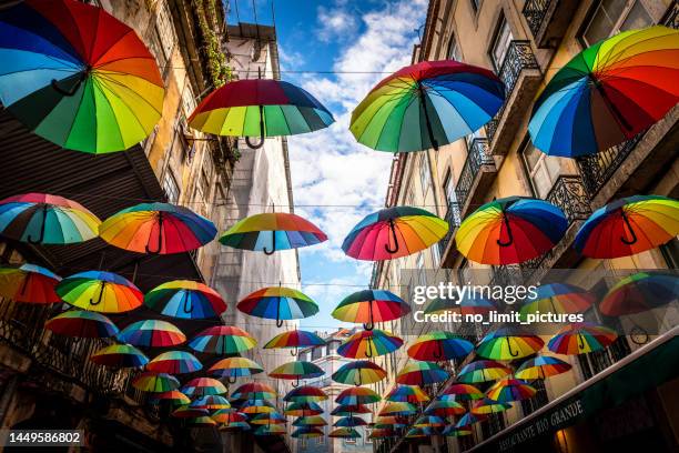 view to a narrow alley with many umbrellas in old town of lisbon - portuguese culture stock pictures, royalty-free photos & images