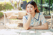 Asian cute young innocent asian teen portrait smile sitting relax leisure good happiness day.