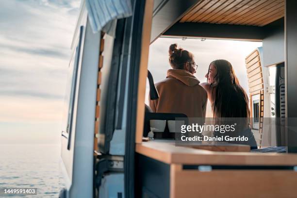 couple in love living in a campervan, valentine's day, love in a campervan - van stock-fotos und bilder