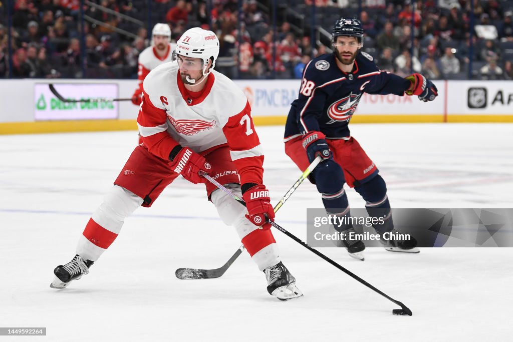 Dylan Larkin of the Detroit Red Wings controls the puck against Boone ...