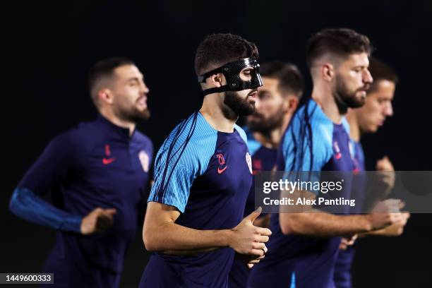 Josko Gvardiol of Croatia looks on during the Croatia Training Session on match day -1 at on December 16, 2022 in Doha, Qatar.