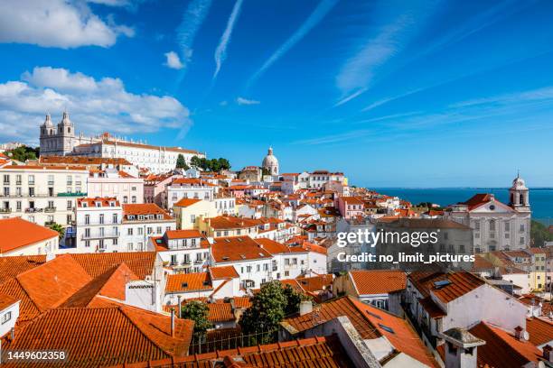 aerial view over the rooftops of lisbon - lissabon stockfoto's en -beelden