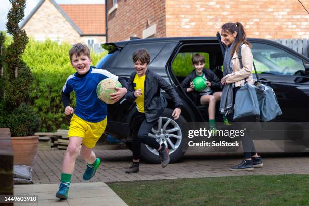 arriving home after football practice - soccer mum stock pictures, royalty-free photos & images