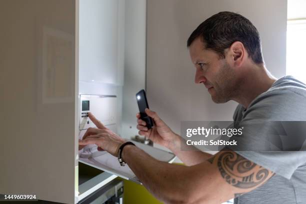 decreasing the temperature at home - adjusting stock pictures, royalty-free photos & images