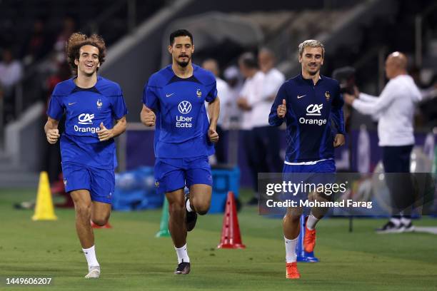 Matteo Guendouzi, William Saliba and Antoine Griezmann of France in action during the Training Session at on December 16, 2022 in Doha, Qatar.