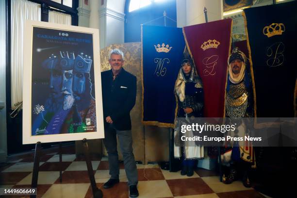 The author of the poster, Andre Merida, with his work, on December 16, 2022 in Malaga . In 2023, the city of Malaga will host the centenary of the...