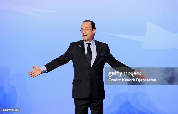 President of France Francois Hollande reacts as he departs following the family photo after meeting on Afghanistan during the NATO Summit at...