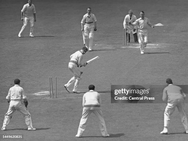 Alan Revill of Derbyshire County Cricket Club looks down at the stumps after being clean bowled for 0 by Eddie Watts of Surrey County Cricket Club...