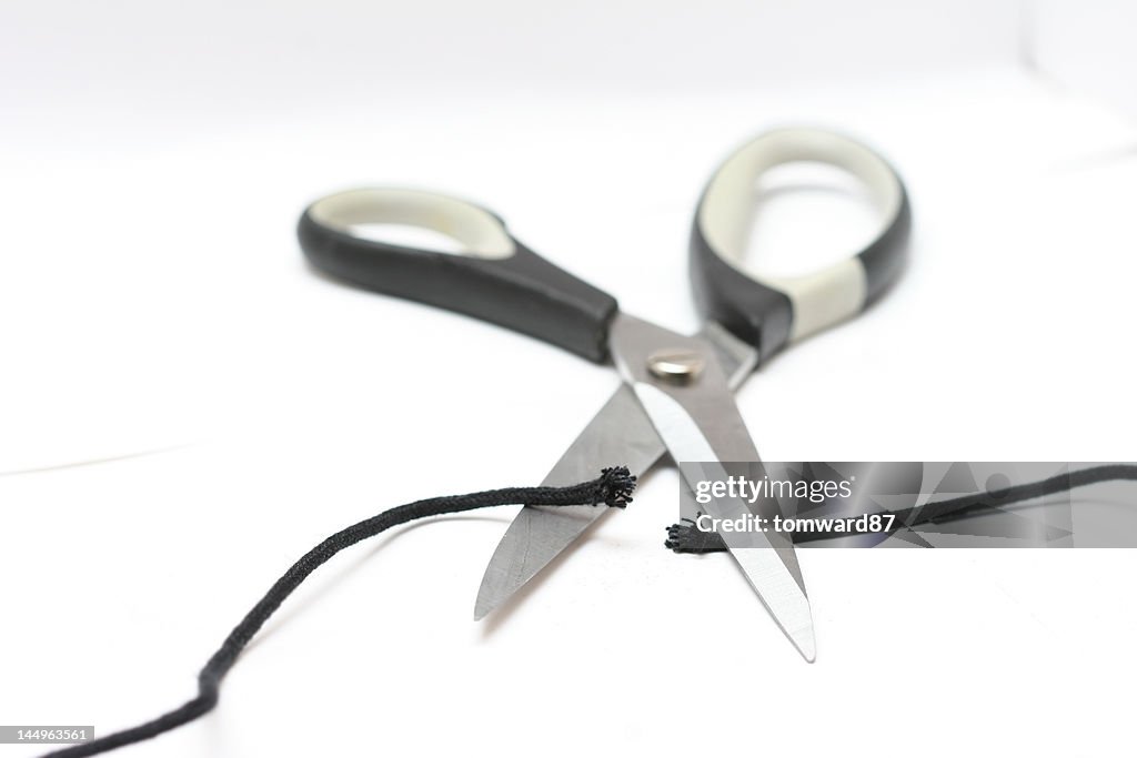 Cutting String on White