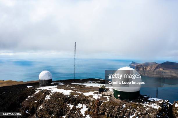 Other-worldly white globes on the rugged rock are the remnants of a Cold War military base.