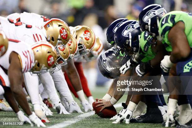 The San Francisco 49ers and Seattle Seahawks line up during the fourth quarter at Lumen Field on December 15, 2022 in Seattle, Washington.