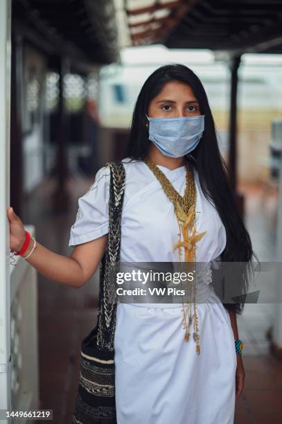 Portrait of young Arhuaco indigenous woman wearing a face mask during the Covid-19 outbreak in Colombia.