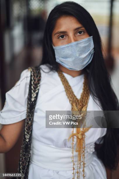 Portrait of young Arhuaco indigenous woman wearing a face mask during the Covid-19 outbreak in Colombia.