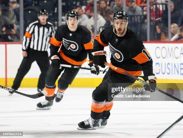 Kevin Hayes of the Philadelphia Flyers skates with Travis Sanheim against the Washington Capitals at the Wells Fargo Center on December 7, 2022 in...