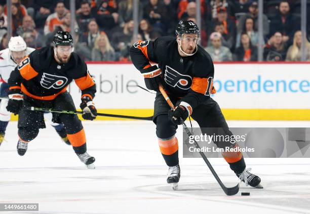 Kevin Hayes of the Philadelphia Flyers skates the puck with Ivan Provorov against the Washington Capitals at the Wells Fargo Center on December 7,...