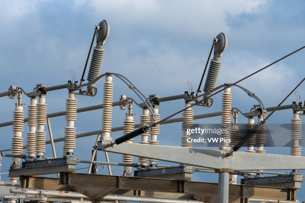 Full load break interrupter attachments on an electrical power transmission substation