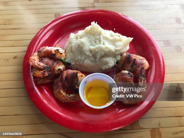 Fresh bacon-wrapped Gulf shrimp and garlic mashed potatoes at a restaurant in Rockport, Texas.