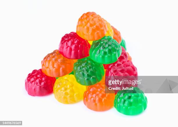 pyramid of coloured jelly beans. isolated on white background - jelly sweet stock pictures, royalty-free photos & images
