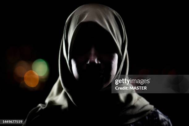 muslim woman with hijab night portrait - arab woman silhouette stock pictures, royalty-free photos & images