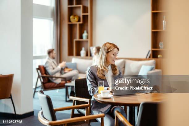 business woman writing notes - vip lounge stock pictures, royalty-free photos & images