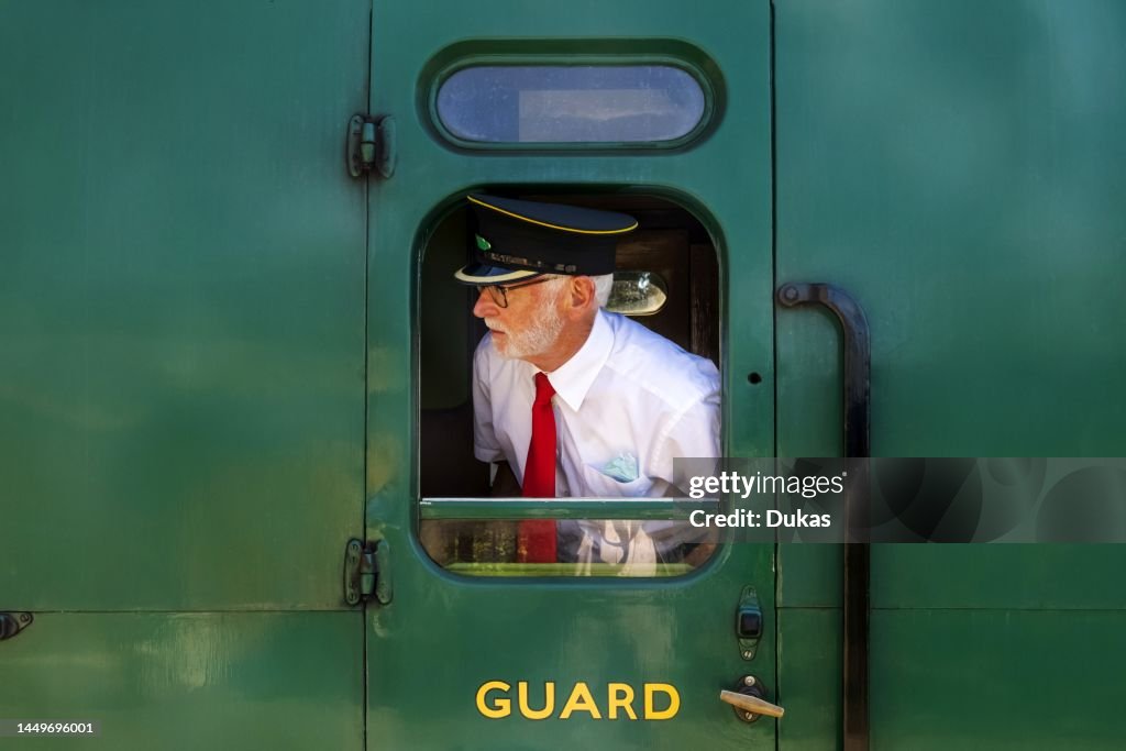 The Mid-Hants Heritage Railway aka The Watercress Line, Train Guard Looking Out of Train Carriage Window
