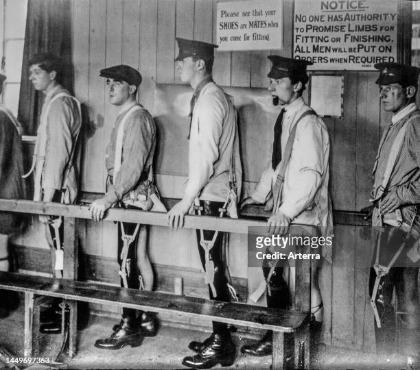 British WWI soldiers / leg amputees fitted with artificial limbs / prosthetic legs at Roehampton House hospital in London during First World War One.