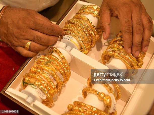 Customers select gold jewellery at a jewellery shop on Akshaya Tritiya, an annual Hindu and Jain spring festival, at Agartala. It is one of the most...