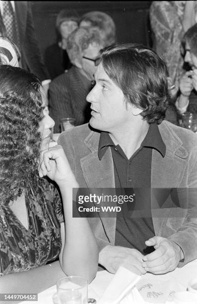 Diahnne Abbott and Robert De Niro attend an awards ceremony at Sardi's in New York City on January 30, 1977.