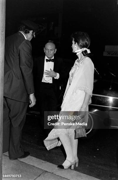 Yul Brynner and Jacqueline de Croisset attend a party at Raga's in New York City on May 2, 1977.