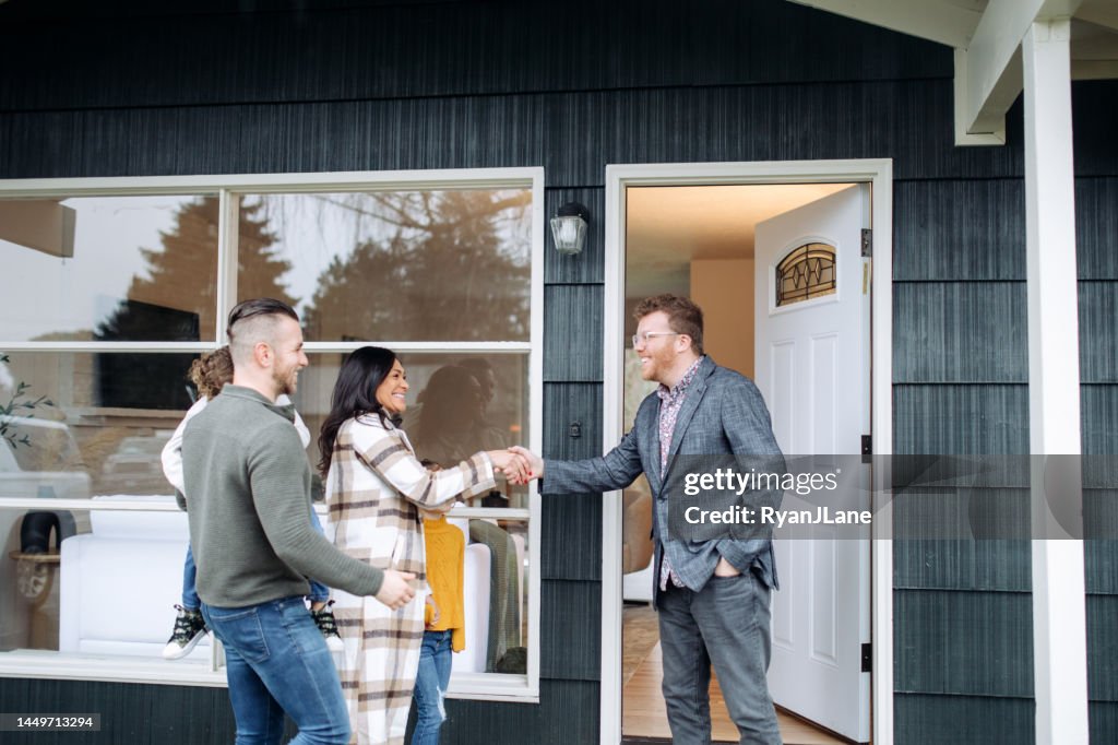 Real Estate Agent Meeting Prospective Buyers