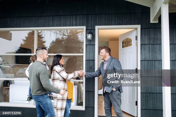 real estate agent meeting prospective buyers - sälja bildbanksfoton och bilder