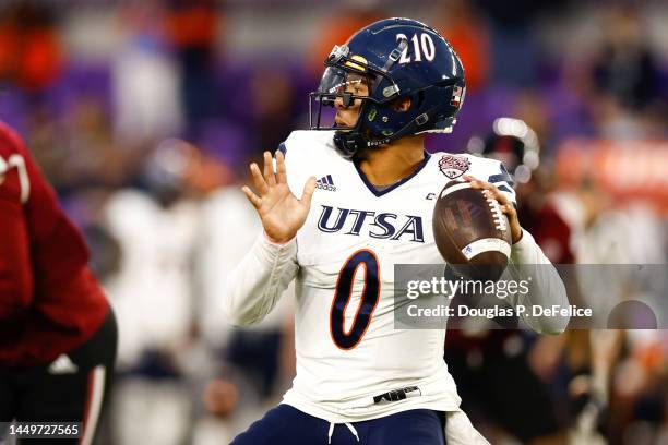 Frank Harris of the UTSA Roadrunners look to pass the ball against the Troy Trojans /d3 of the Duluth Trading Cure Bowl at Exploria Stadium on...