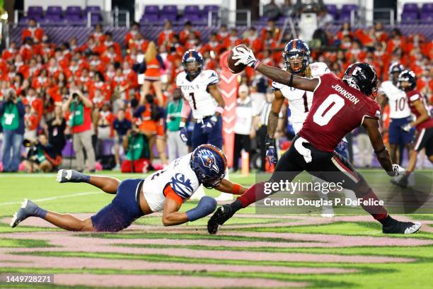 RaJae' Johnson of the Troy Trojans catches the ball for a touchdown against the UTSA Roadrunners during the third quarter of the Duluth Trading Cure...