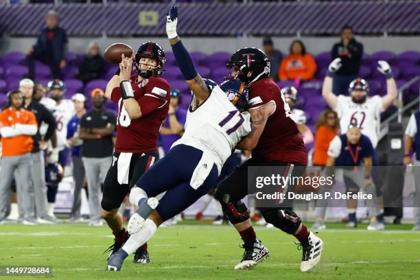 Gunnar Watson of the Troy Trojans looks to pass the ball against the UTSA Roadrunners during the third quarter of the Duluth Trading Cure Bowl at...