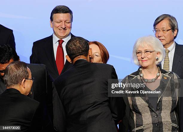 President Barack Obama kisses Prime Minister of Australia Julia Gillard as Prime Minister of Iceland Johanna Sigurdardottir and European Council...