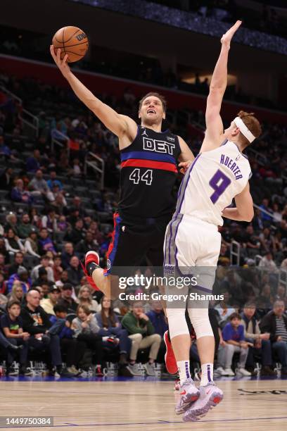 Bojan Bogdanovic of the Detroit Pistons drives to the basket against Kevin Huerter of the Sacramento Kings during the second half at Little Caesars...