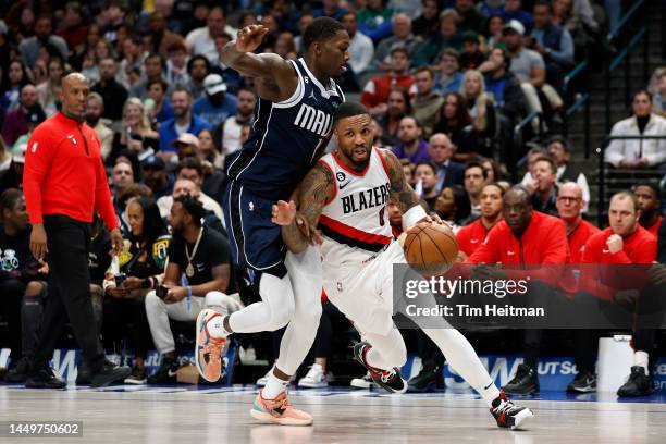 Damian Lillard of the Portland Trail Blazers drives to the basket against Dorian Finney-Smith of the Dallas Mavericks during the second quarter of...