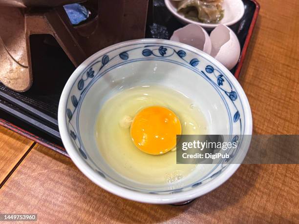 raw egg as sauce for hotpot - sukiyaki stock-fotos und bilder