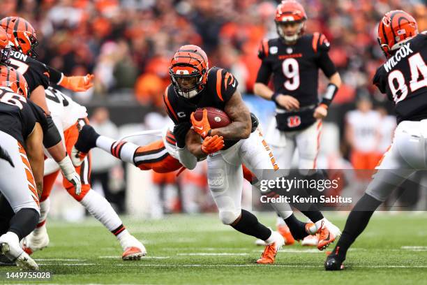 Greedy Williams of the Cleveland Browns attempts to tackle Joe Mixon of the Cincinnati Bengals during the fourth quarter of an NFL football game at...