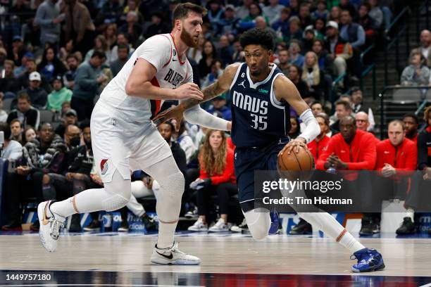 Christian Wood of the Dallas Mavericks drives to the basket against Jusuf Nurkic of the Portland Trail Blazers in the second half of the game at...